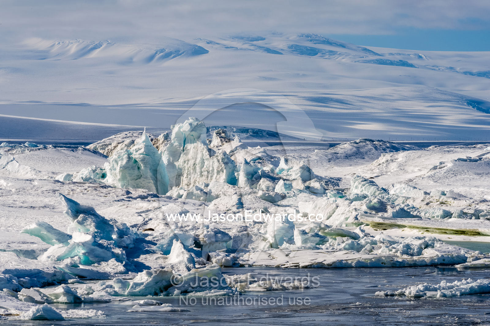 Jagged pressure ridges in the sea ice where it collides with the Ross Ice Shelf. Pram Point, McMurdo Sound, Ross Island, Antarctica.