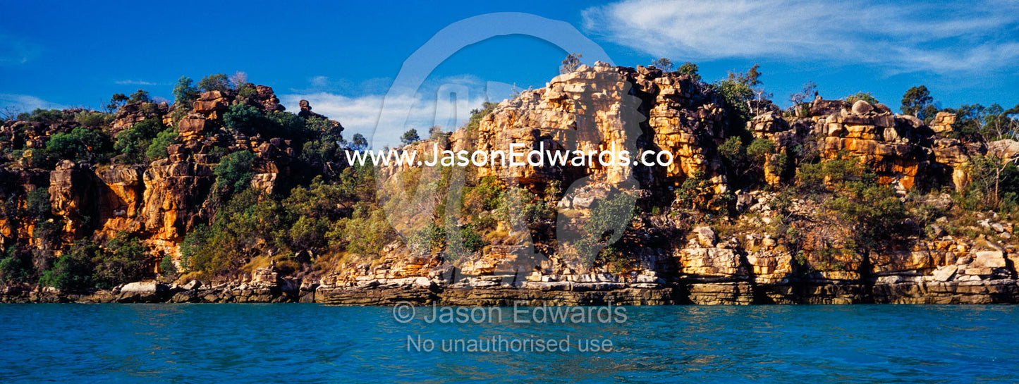 A high tide mark along a rugged sandstone cliff in the Kimberley. Prince Frederick Harbour, Kimberley Coast, Western Australia, Australia.
