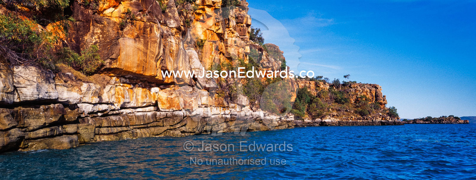 A high tide mark along a rugged sandstone cliff in the Kimberley. Prince Frederick Harbour, Kimberley Coast, Western Australia, Australia.