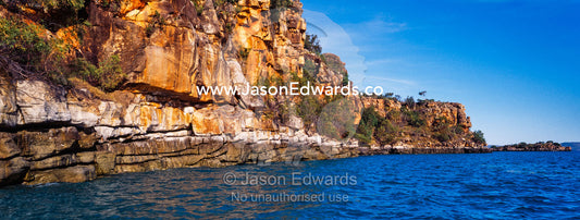 A high tide mark along a rugged sandstone cliff in the Kimberley. Prince Frederick Harbour, Kimberley Coast, Western Australia, Australia.