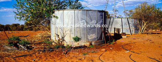 Old water tanks on an abandoned outback cattle station. Ipolera Out Station, Hermannsburg, Northern Territory, Australia.
