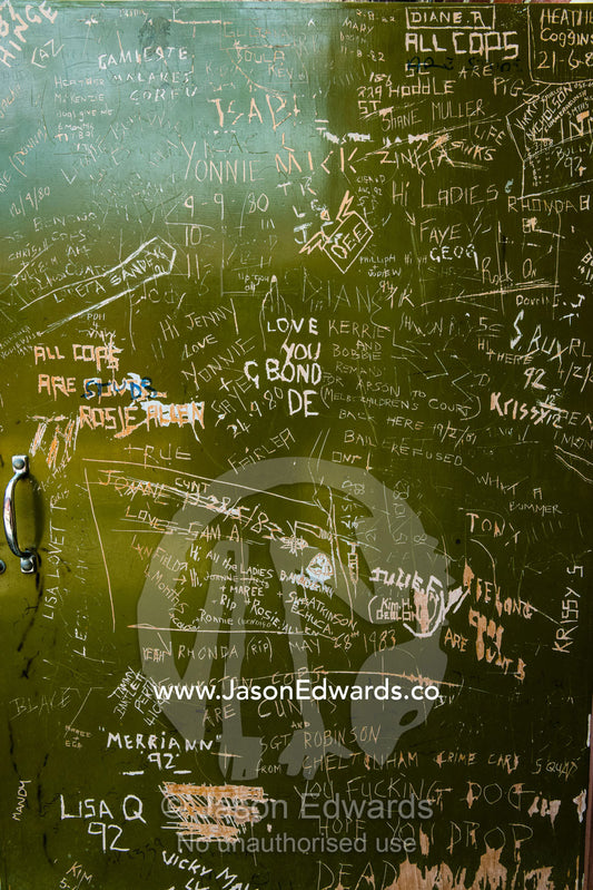 Convict graffiti on a door in a city jail. Melbourne, Victoria, Australia.