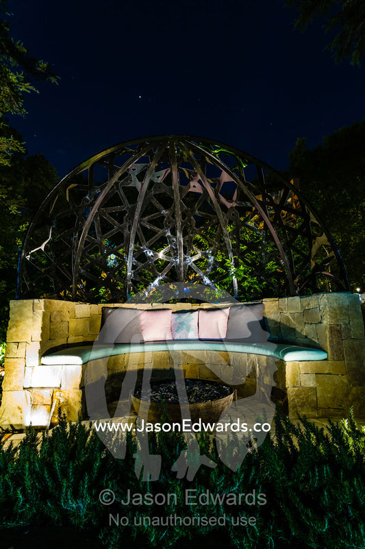 A handmade stone garden seat and fire pit in a city park. Melbourne, Victoria, Australia.