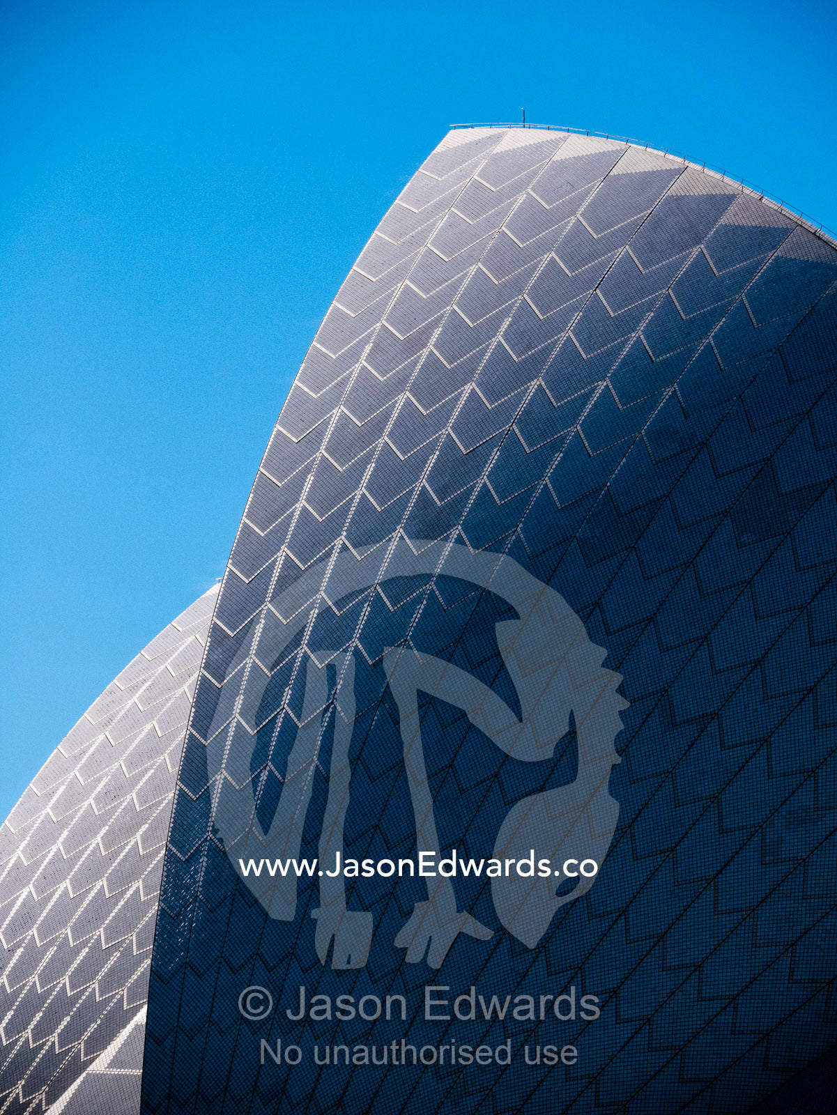The tiled surface of an arching sail dome on the Sydney Opera House. Sydney, New South Wales, Australia.