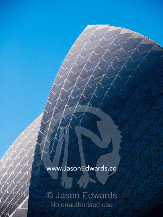The tiled surface of an arching sail dome on the Sydney Opera House. Sydney, New South Wales, Australia.
