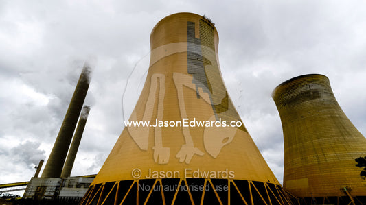 Steam pours from a cooling tower chimney at a coal powered electricity station. Traralgon, Victoria, Australia.