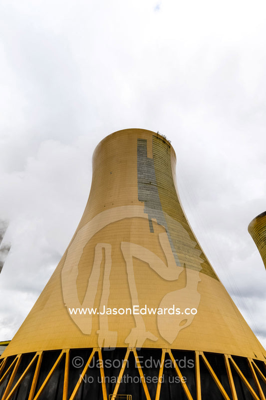Steam pours from a cooling tower chimney at a coal powered electricity station. Traralgon, Victoria, Australia.