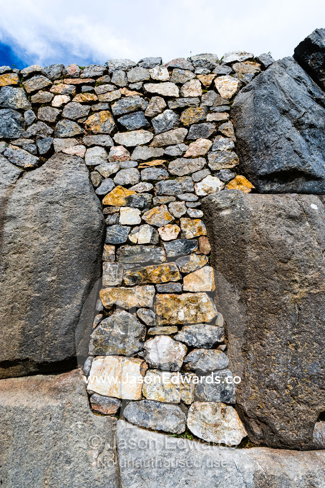 Rocks used to seal a breach in an Inca citadel dry stone wall. Cusco, Peru.