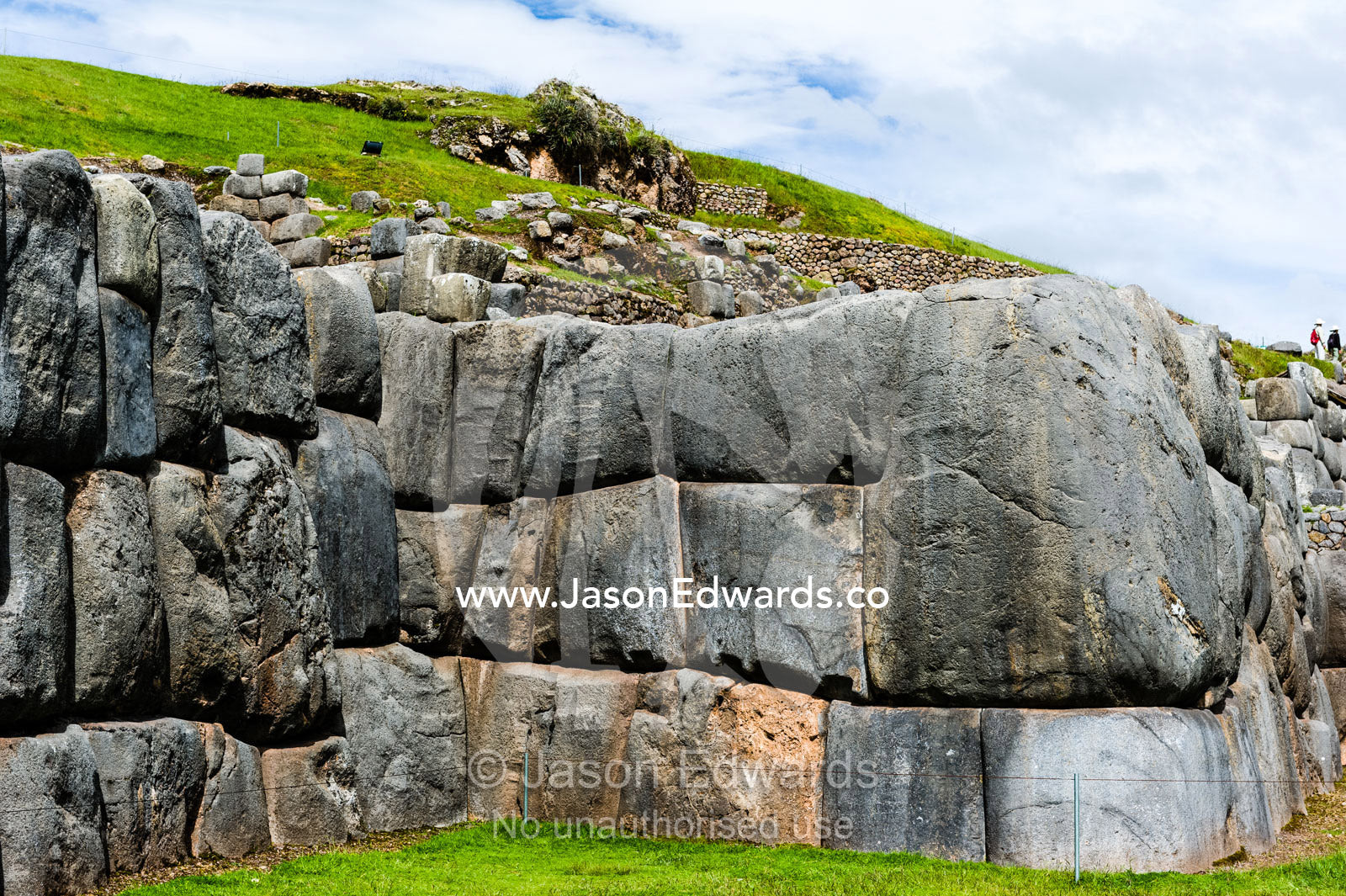 The Inca carved interlocking dry-stone walls from boulders to build a citadel terrace wall. Cusco, Peru.