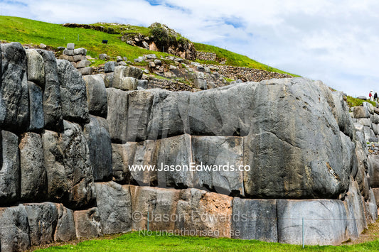 The Inca carved interlocking dry-stone walls from boulders to build a citadel terrace wall. Cusco, Peru.