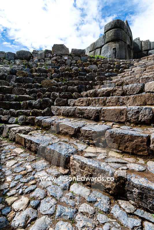 A flight of steps carved from granite boulders in an Inca citadel. Cusco, Peru.
