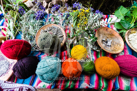 Amaru people using natural dyes to colour sheeps wool to make balls of yarn. Pisac, Peru.