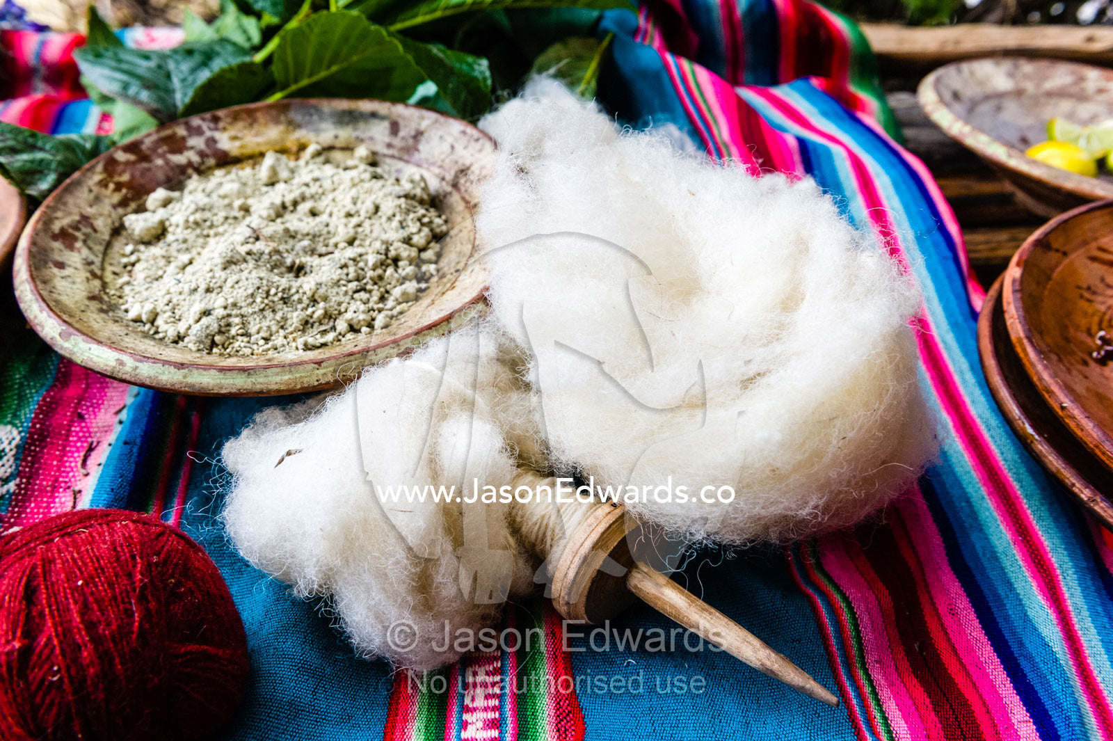 Amaru people using natural dyes to colour sheeps wool for spinning yarn. Pisac, Peru.