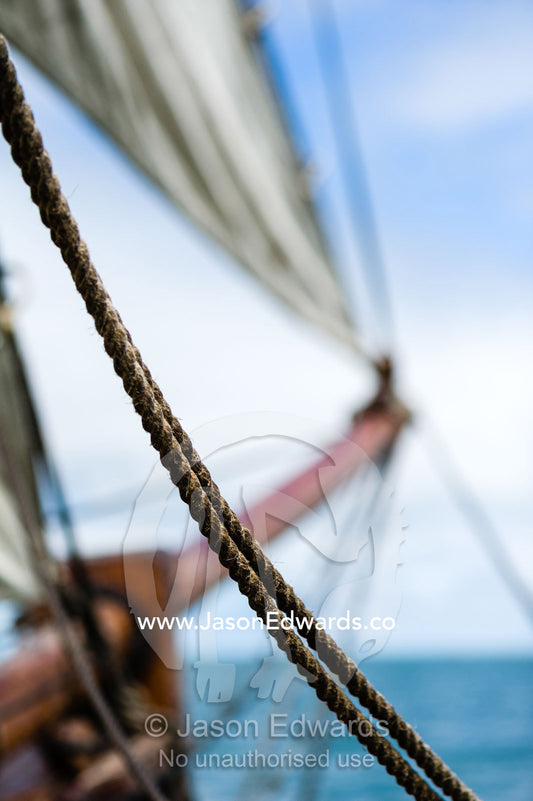 Sail ropes and the bow sprit on an antique timber sailing ship. Melbourne, Victoria, Australia.