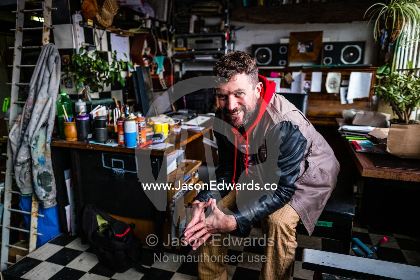A portrait of a graffiti street artist in his inner city studio. Collingwood, Victoria, Australia.
