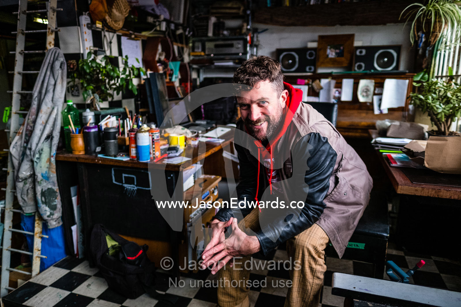 A portrait of a graffiti street artist in his inner city studio. Collingwood, Victoria, Australia.