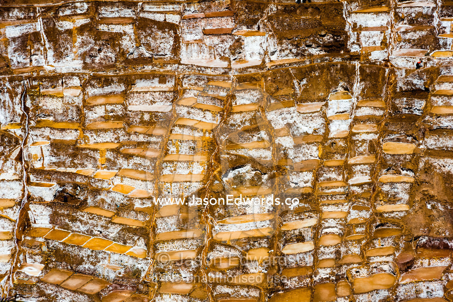 An Inca salt mine made up of salty spring water ponds evaporating. Maras, Peru.