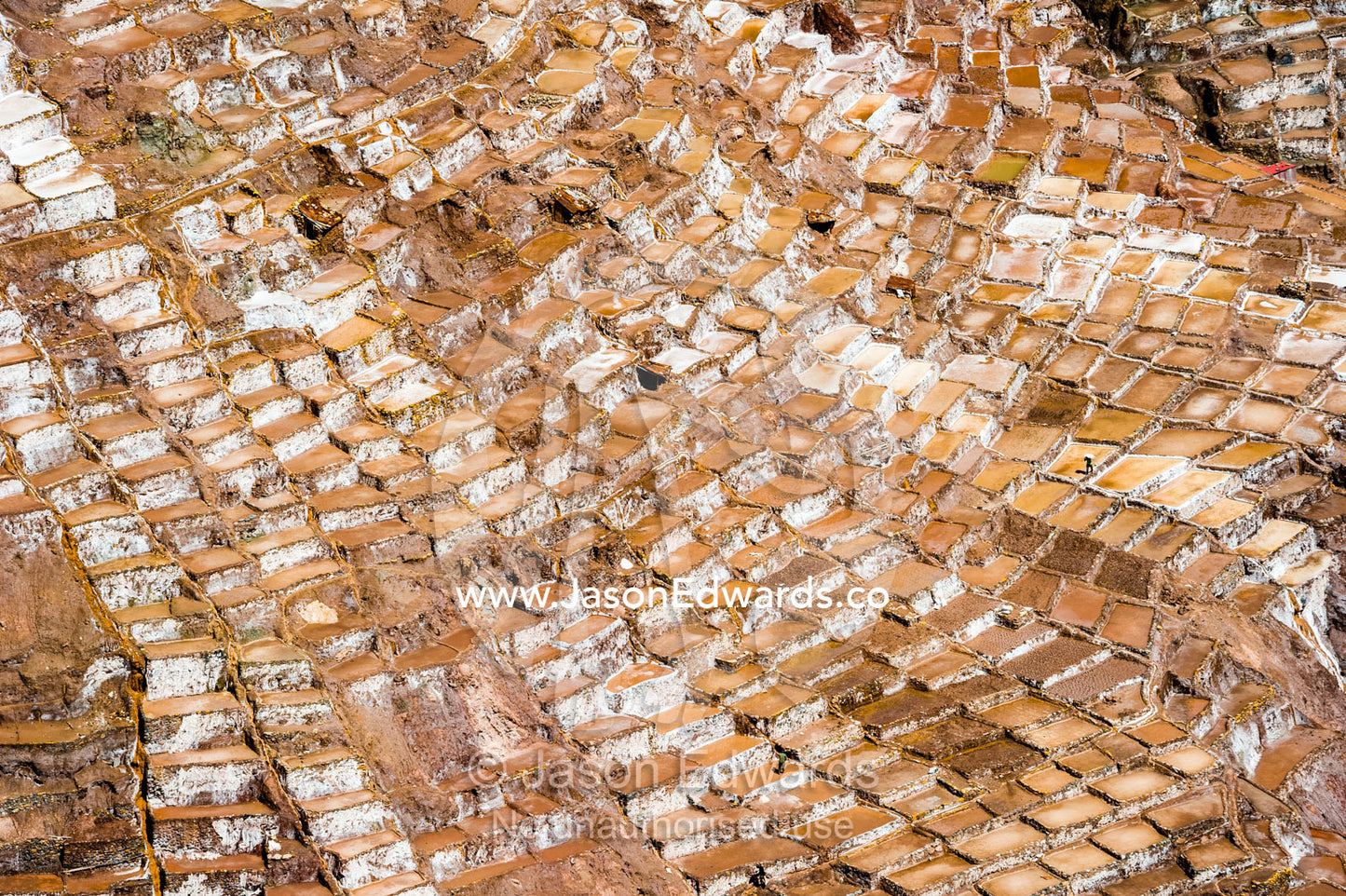 An Inca salt mine made up of salty spring water ponds evaporating. Maras, Peru.