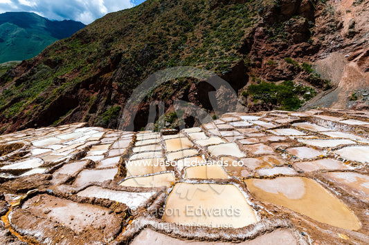 An Inca salt mine made up of salty spring water ponds evaporating. Maras, Peru.