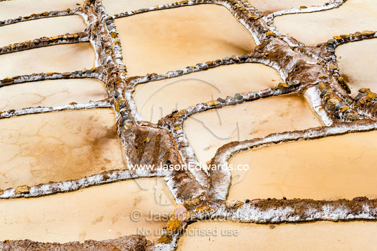 An Inca salt mine made up of salty spring water ponds evaporating. Maras, Peru.