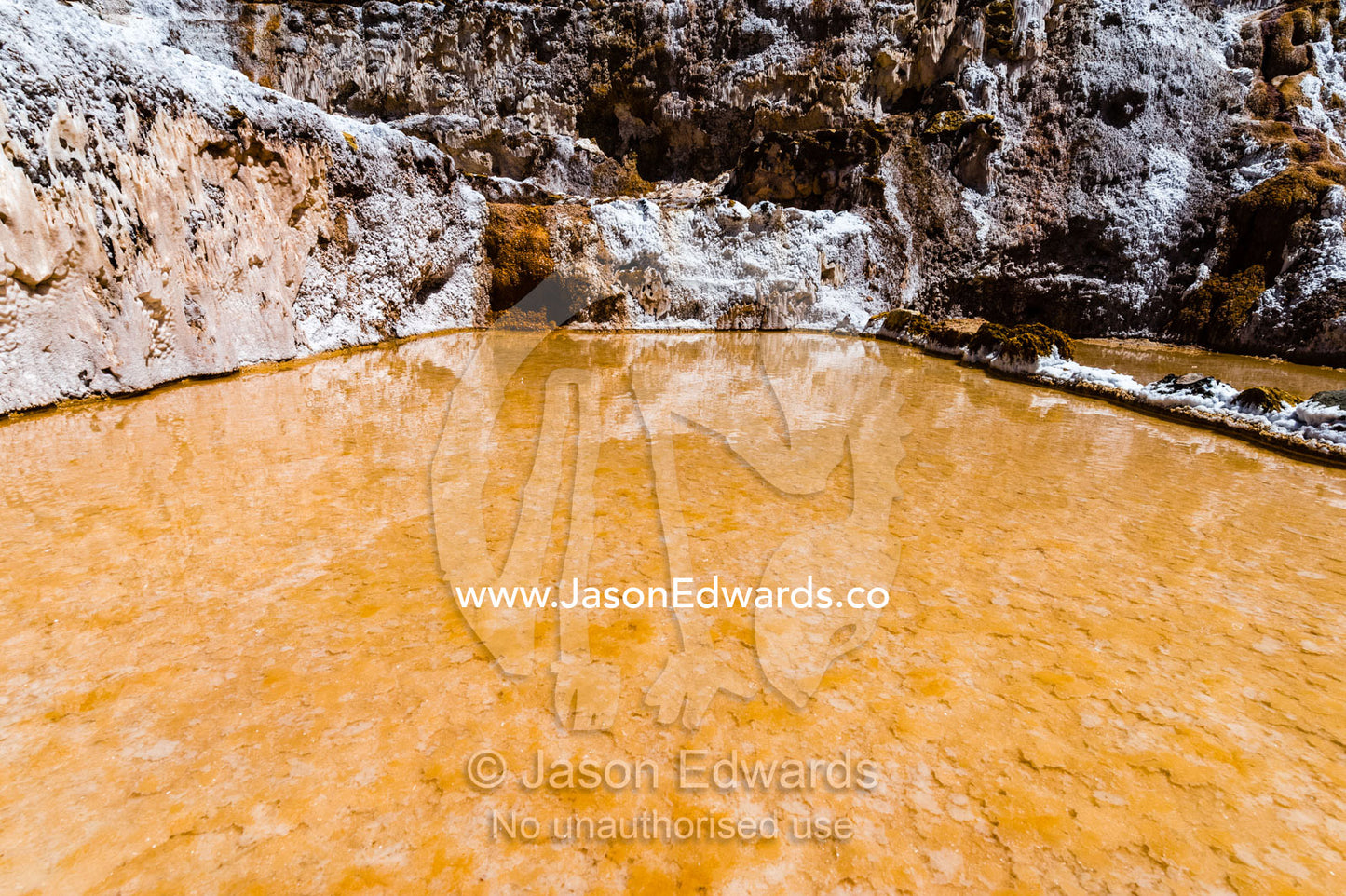 An Inca salt mine made up of salty spring water ponds evaporating. Maras, Peru.