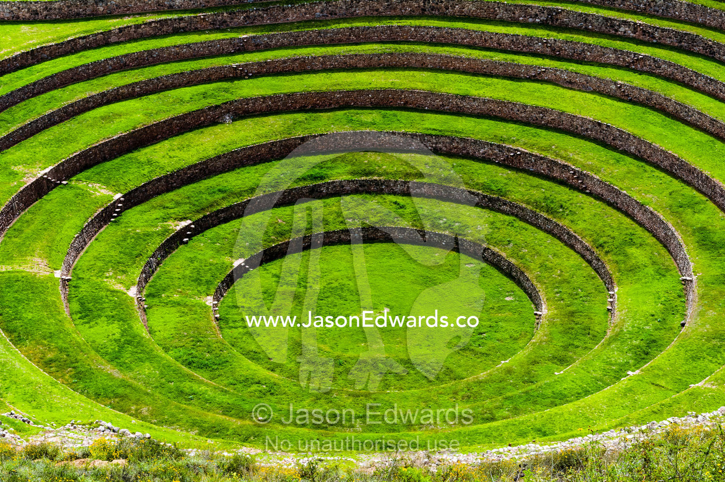 An Inca site with stone wall terraces for growing agricultural crops by creating microclimates. Maras, Peru.