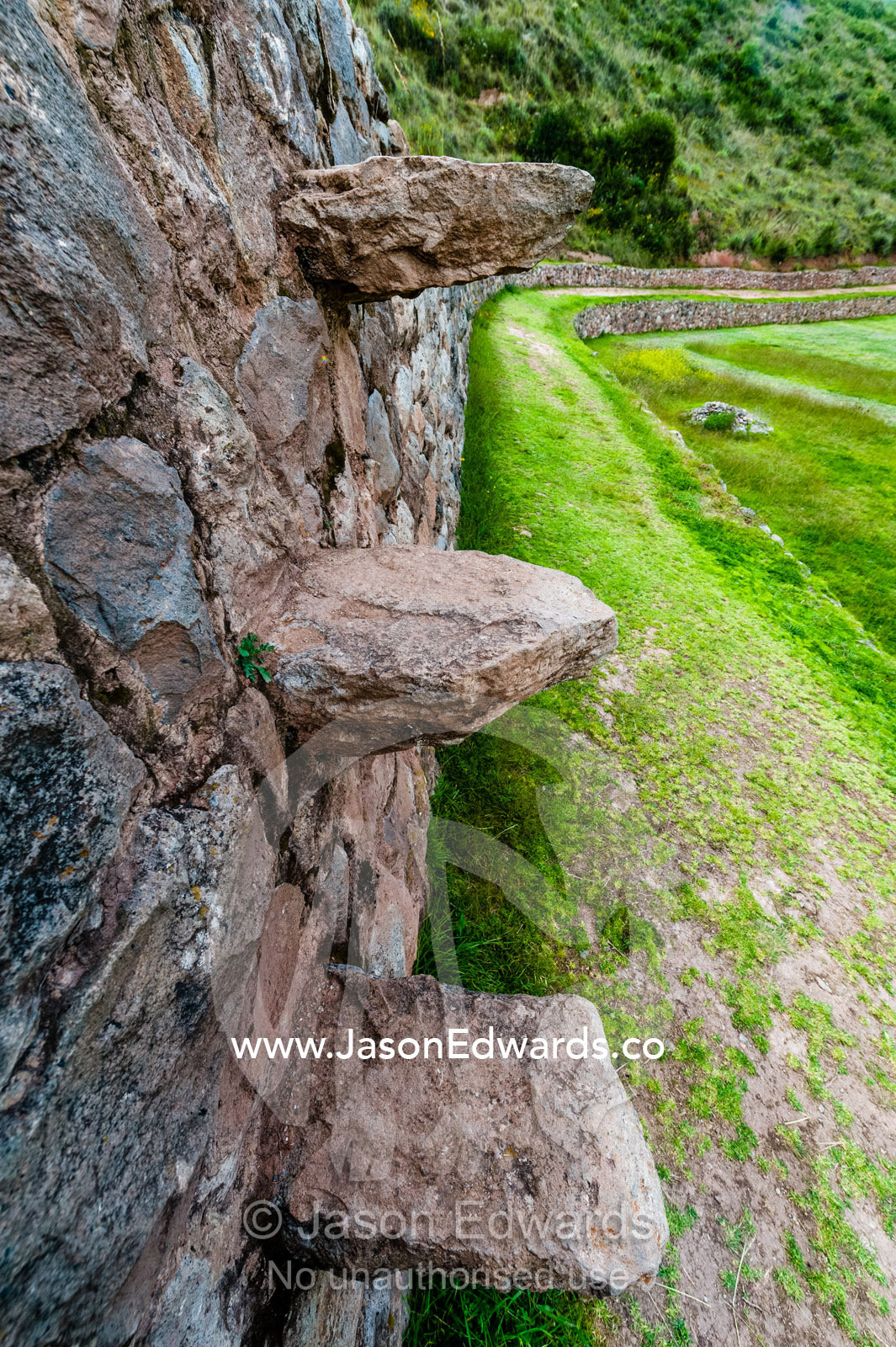 An Inca agricultural site with stone wall terraces with floating stairs. Maras, Peru.