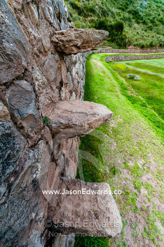 An Inca agricultural site with stone wall terraces with floating stairs. Maras, Peru.