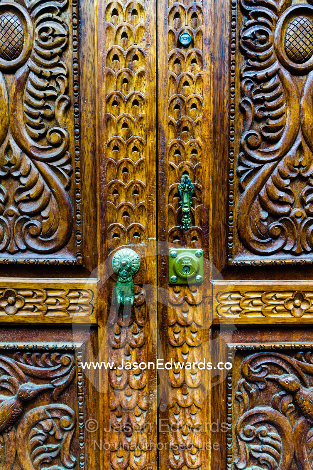 An intricately carved wooden door. Ollantaytambo, Peru.