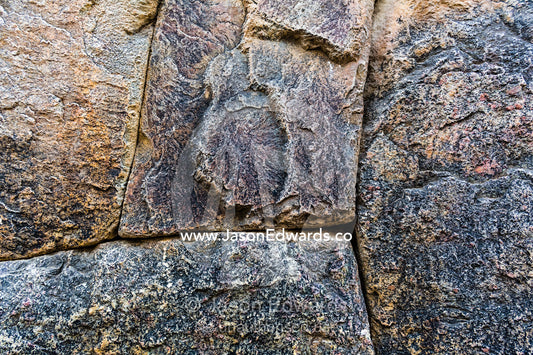 An Inca interlocking dry-stone wall built from carved boulders using joinery and no mortar. Ollantaytambo, Peru.