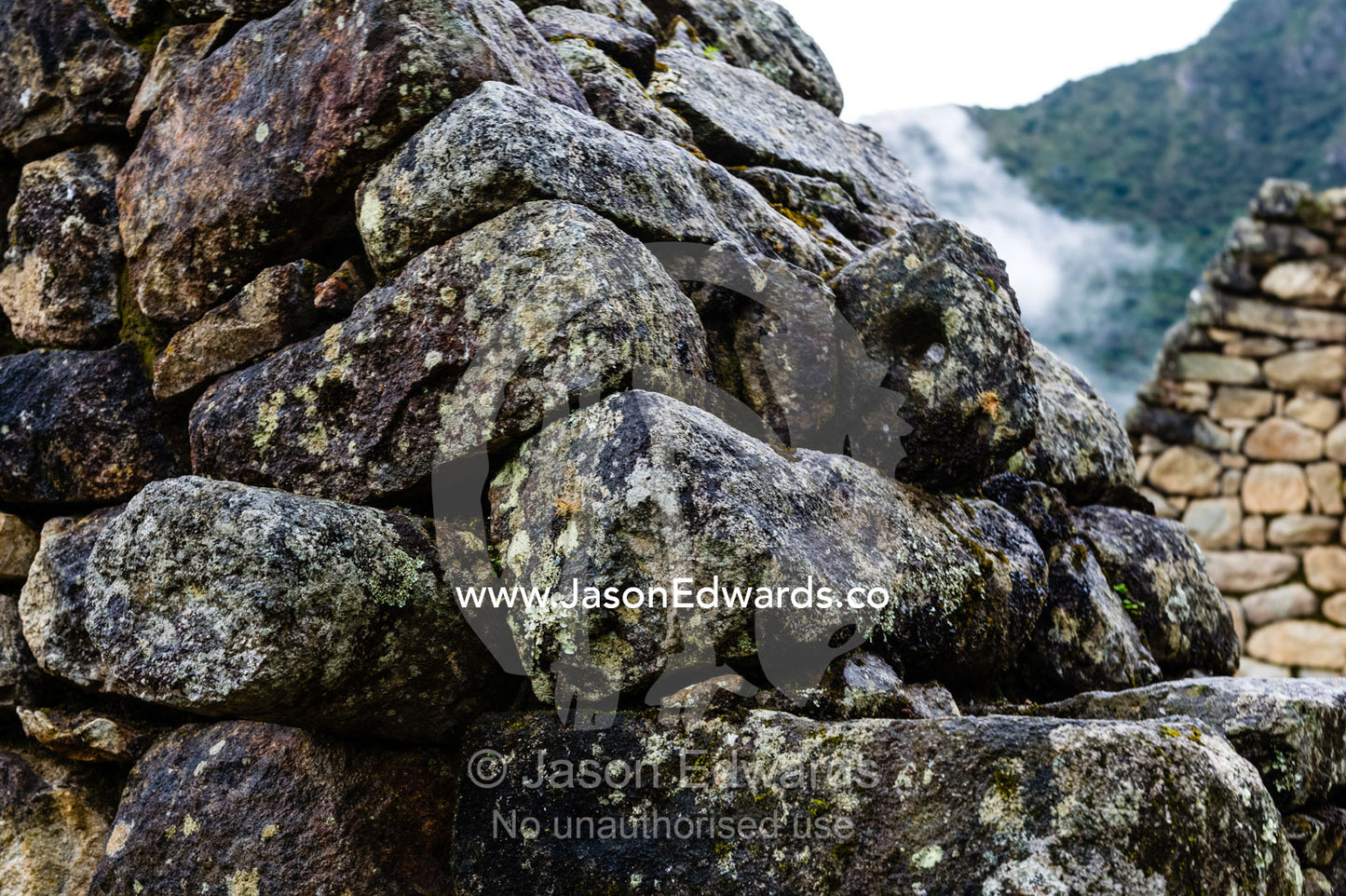 A detail of stones stacked to form a wall in a residential building at Macchu Picchu. Peru.