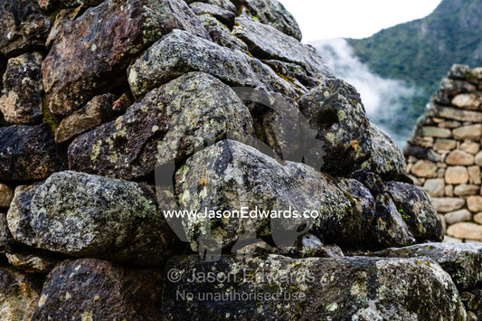 A detail of stones stacked to form a wall in a residential building at Macchu Picchu. Peru.