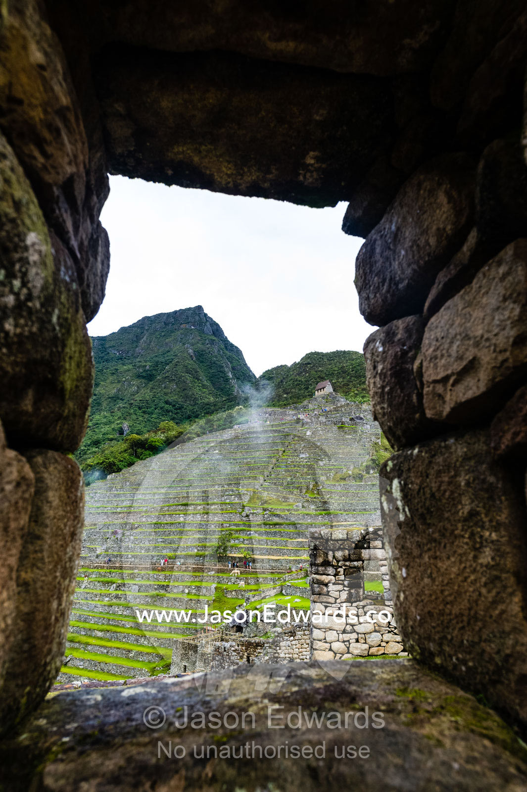 A trapezoidal window in a wall in a residential building at Macchu Picchu. Peru.