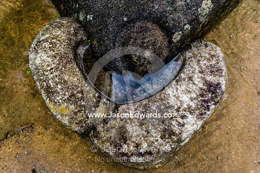 The Temple of the Condor with a carving of an Andean Condor head and an alter in a natural cave. Peru.