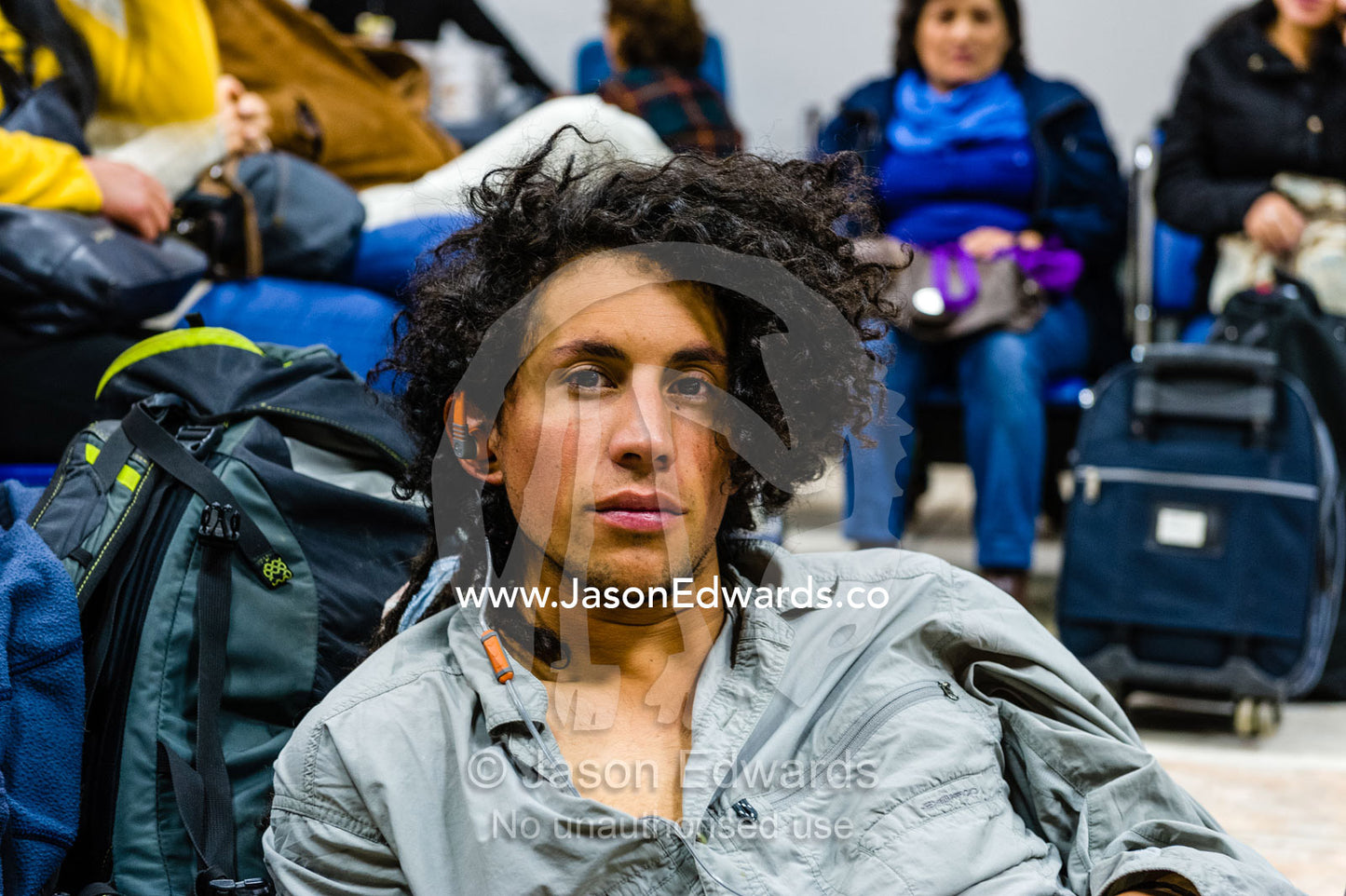 People waiting to board planes in an airport. Cusco, Peru.