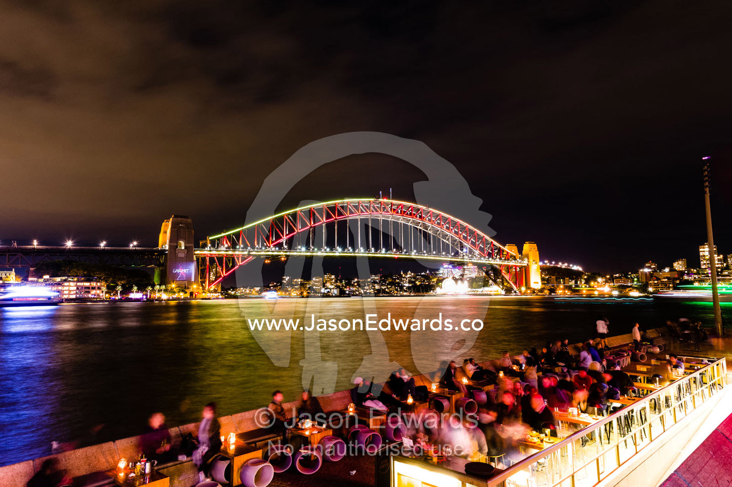 The Sydney Harbour Bridge coloured red during Vivid Sydney Light, Music and Ideas Festival. Sydney, New South Wales, Australia.