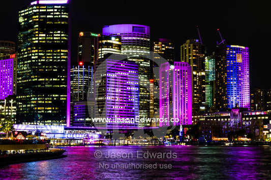 The Sydney skyline illuminated in colourful lights at the Vivid Sydney Festival. Sydney, New South Wales, Australia.