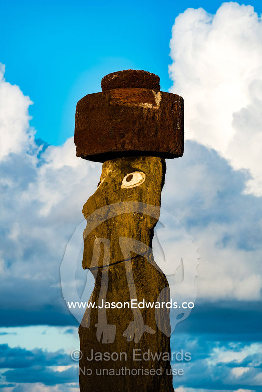 The human figure of a Moai statue wearing a topknot on the coast of Easter Island. Ahu Tahai, Rapa Nui, Easter Island, Chile