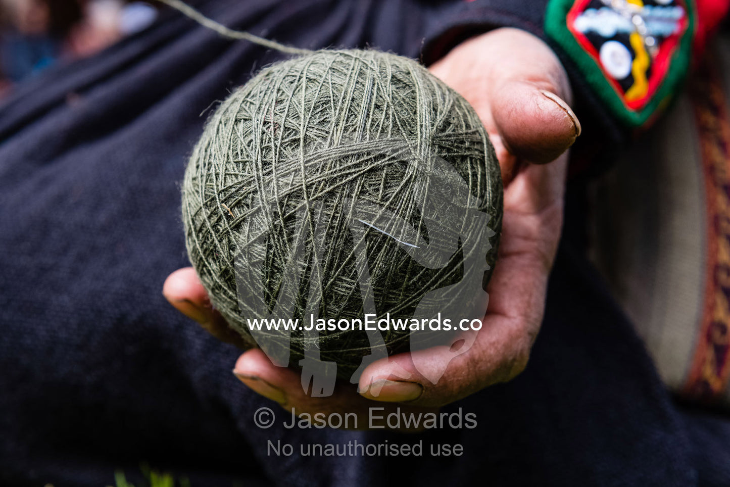A ball of green Llama wool ready for weaving. Chinchero, Chinchero District, Urubamba Province, Peru