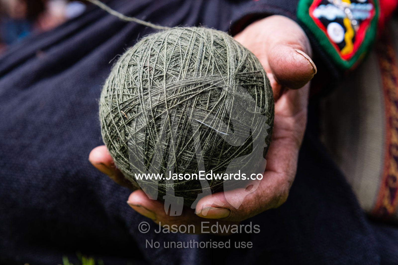 A ball of green Llama wool ready for weaving. Chinchero, Chinchero District, Urubamba Province, Peru