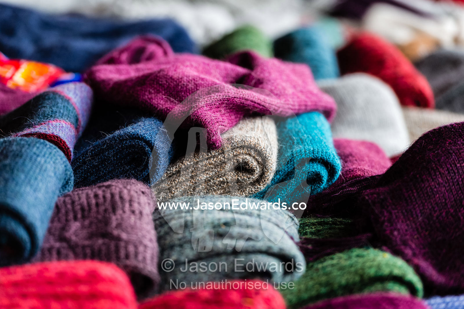 Colorful Llama wool scarfs for sale in an Andean village. Chinchero, Chinchero District, Urubamba Province, Peru