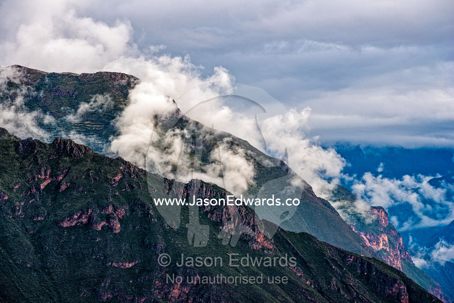 Cloud and mist roll over the Andes Mountain range. Sacred Valley, Andes Mountain Range, Cusco Region, Peru