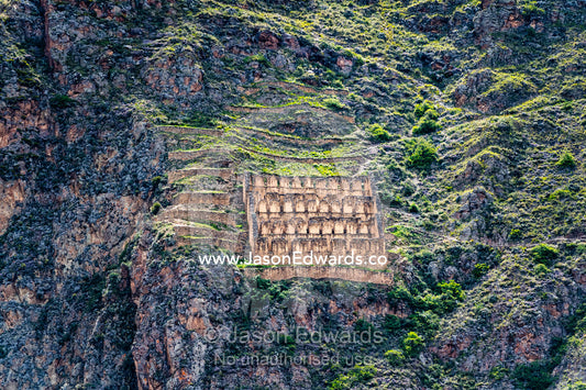 Ruins of an Inca granary for storing grain situated on a steep mountainside to protect the harvest from thieves. Sacred Valley, Ollantaytambo, Urubamba, Peru