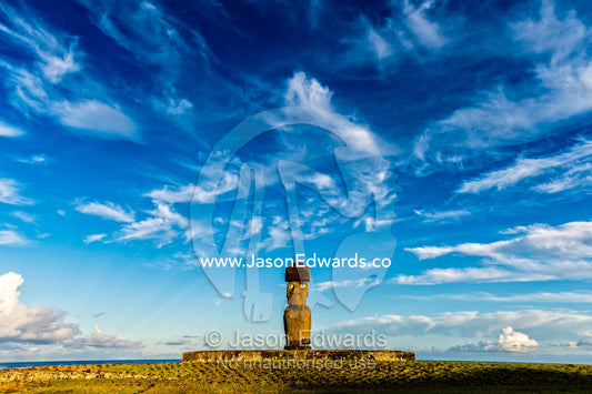 The human figure of a Moai statue wearing a topknot on the coast of Easter Island. Ahu Tahai, Rapa Nui, Easter Island, Chile