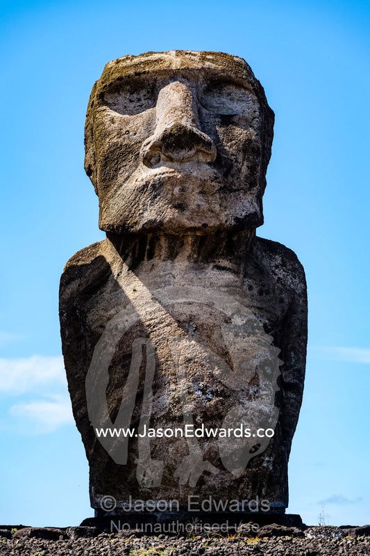 The weathered stone face of an ancient Moai statue representing a human figure. Ahu Tongariki, Rapa Nui, Easter Island, Chile