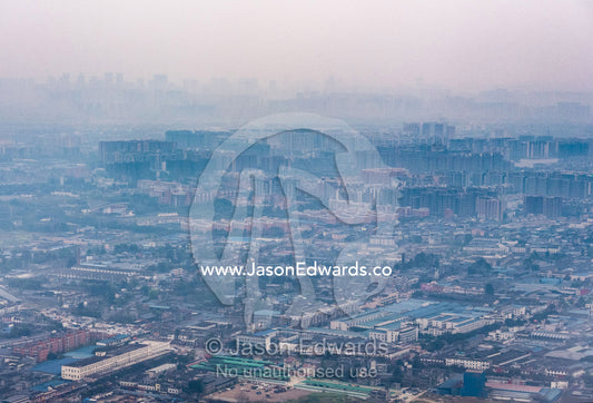 Pollution over a crowded city and suburbs in Western China. Chengdu, Sichuan Province, China