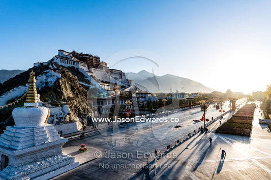 The towering facade, shield wall and bastions of the Potala Palace overlooking the Himalaya at dawn. Lhasa, Tibet Autonomous Region, Tibet