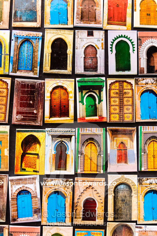 A collection of refrigerator magnets featuring colorful doors in Morocco. Marrakech, Marrakech Souk, Medina of Marrak, Morocco