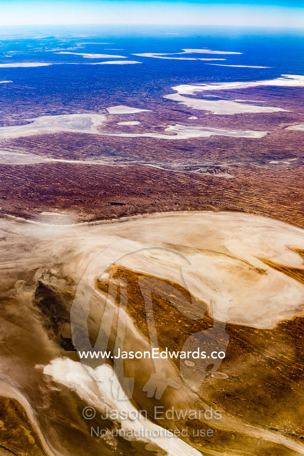 An aerial view of vast sand patterns in the desert caused by evaporation and erosion. Northern Territory, Australia
