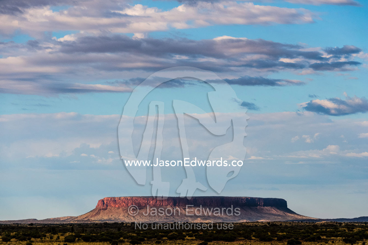 Mount Conner, a flat-topped inselberg rises from the desert plain. Mount Conner, Northern Territory, Australia
